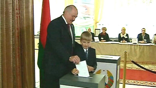 President Alexander Lukashenko casting his vote with his youngest son Nikolai
