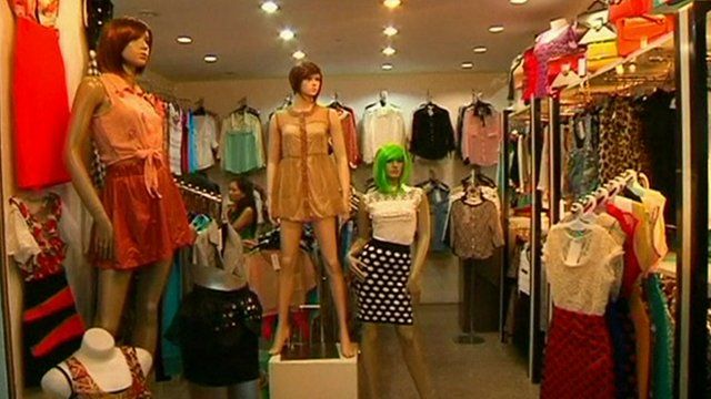 A selection of different clothing in a shop