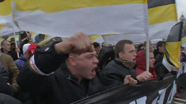 Russians march with banners and flags