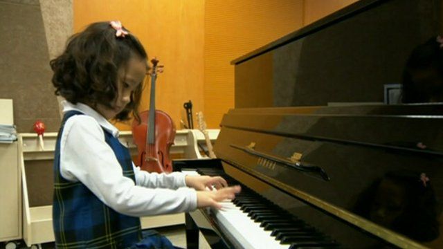 Child plays piano