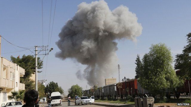 Smoke rises over town