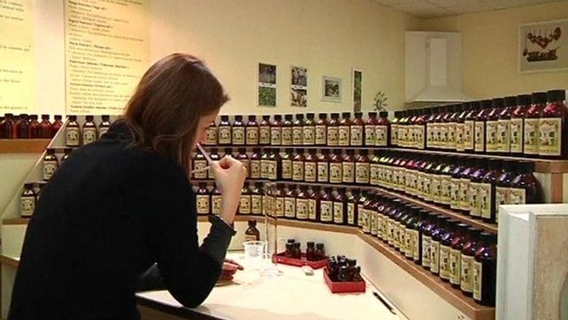 Woman smelling perfumes