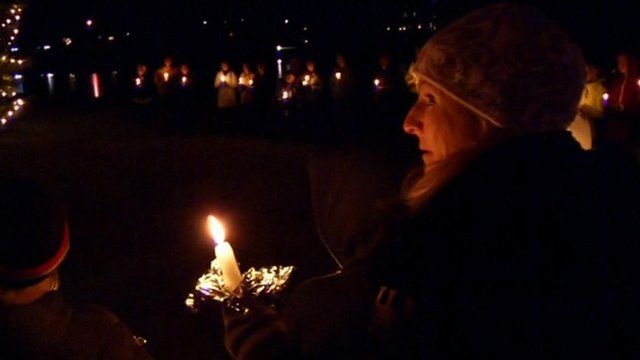 People at a candle lit vigil