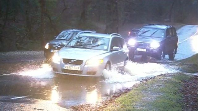 Cars driving through flood water