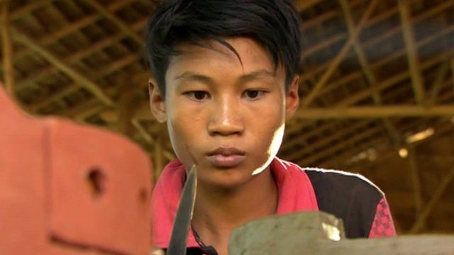 Man makes clay oven