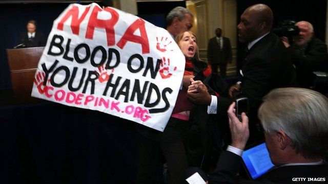 Woman carrying a protest banner