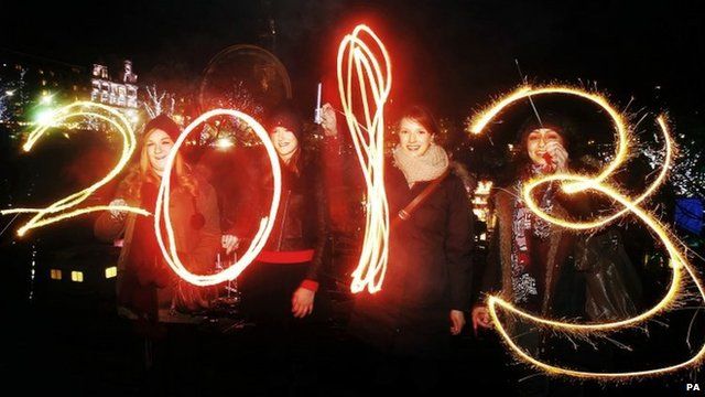Revellers with sparklers spelling out 2013
