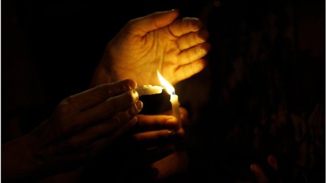 person holding a candle