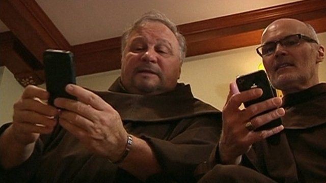 Friars with mobile phones