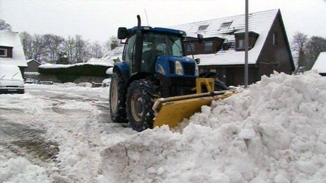 Snow plough clearing snow