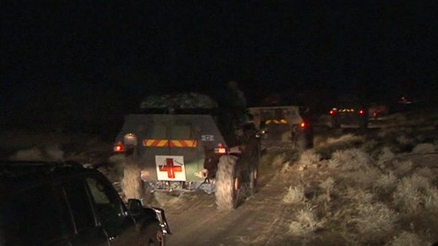 French-led troops advance in trucks across the desert toward Timbuktu