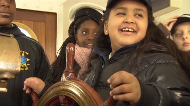 School children climb aboard HQS Wellington