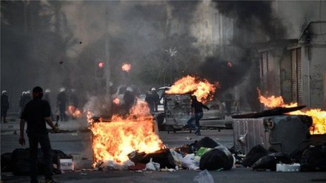 Protesters clash with security forces in the village of Sanabis, west of the capital Manama.