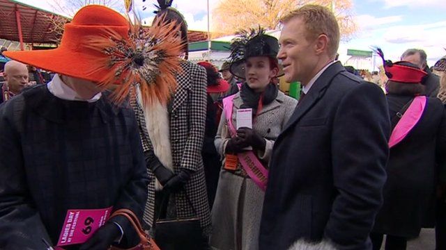 Adam Henson talks with a group of women at the National Hunt Festival in Cheltenham