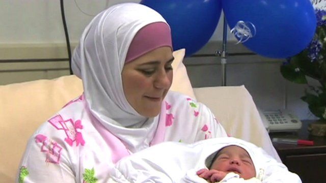 Dallal with her newborn baby