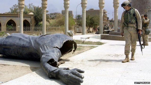 Fallen statue of Saddam Hussein