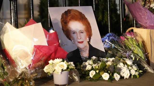 Flowers and a picture left outside the home of Margaret Thatcher