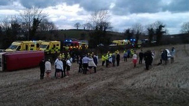 guests at the scene of the bus crash on the Ballynahinch Road