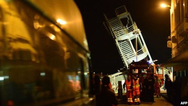 The toppled control tower in the port of Genoa, northern Italy, after a cargo ship slammed into it killing at least three people (May 8 2013)