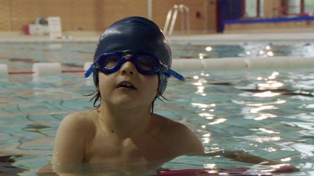 A child in a swimming pool