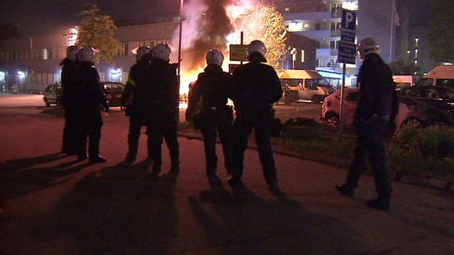 Emergency workers close to a fire