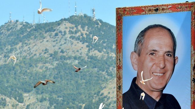 Don Giuseppe Puglisi image with doves