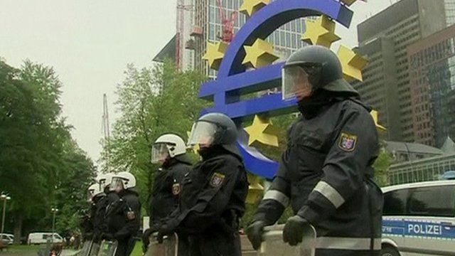 Police in front of euro sign
