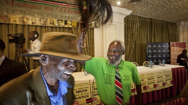A Mau Mau veteran waves a a ceremonial whisk to celebrate