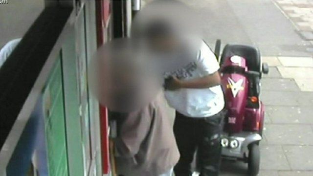 Still from CCTV footage shows a distraction robbery
