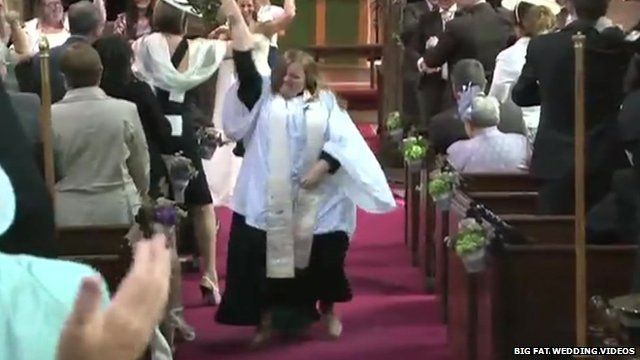Vicar Kate Bottley leads a disco dance celebration at the end of a wedding ceremony in Blyth