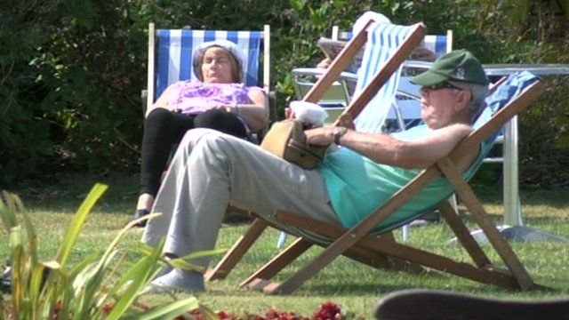 A man and a woman relaxing in the sun