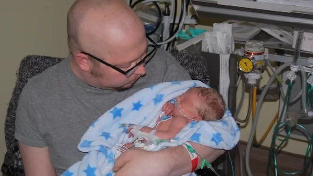 Chris Buckley with his baby son