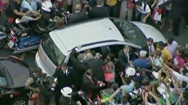 Pope Francis was mobbed as he was driven through Rio