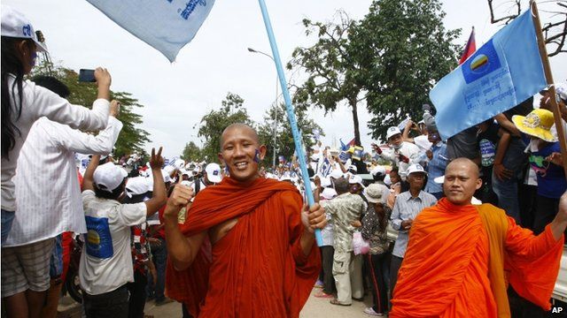 Monks carrying CNRP flags