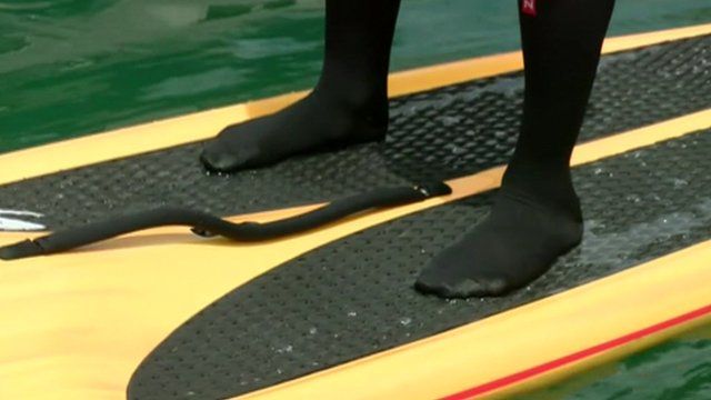 Feet on paddle board