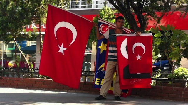 Man holds flags