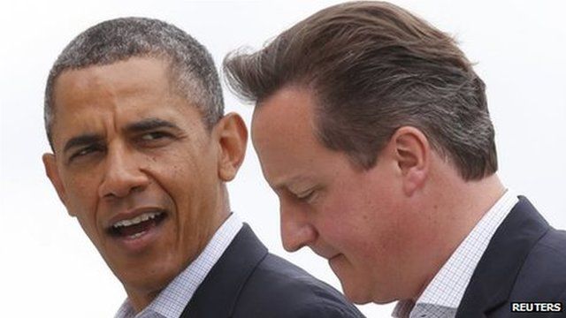 US President Barack Obama walks with Britain's Prime Minister David Cameron during the G8 summit at the Lough Erne golf resort