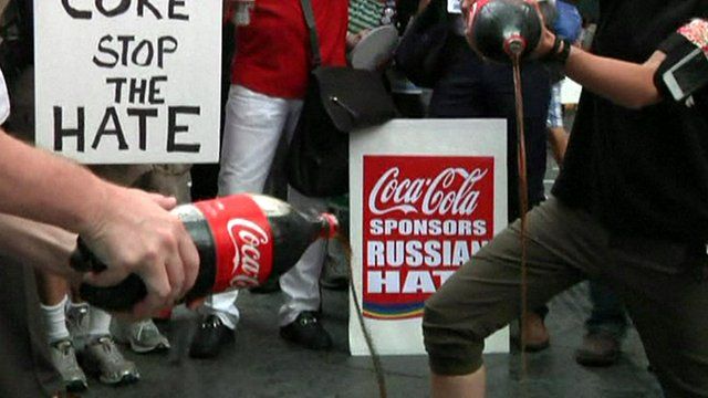 Demonstrators pour Coca Cola down a drain in New York