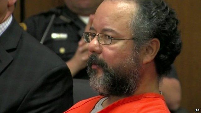 Ariel Castro in an orange jumpsuit inside court.