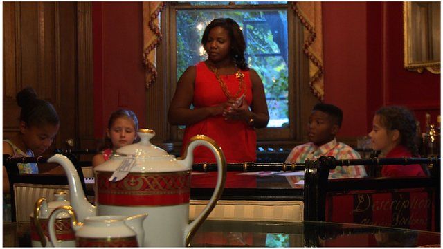 Children at a table during an etiquette class in Washington