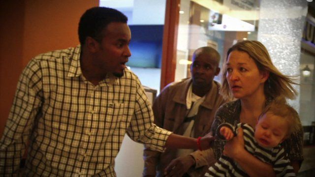 Abdul Haji rescuing a woman and child