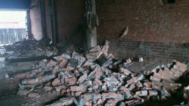 The rubble remains of the mural