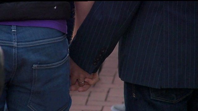 Gay couple holding hands