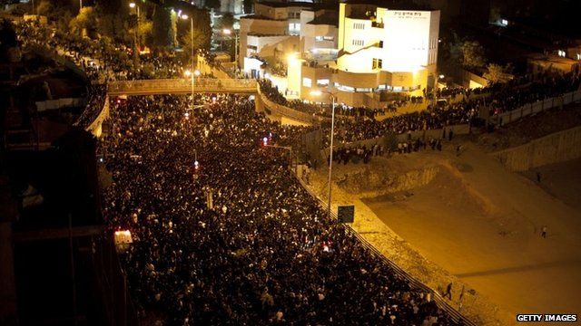 Jewish mourners observe the funeral of Rabbi Ovadia Yosef