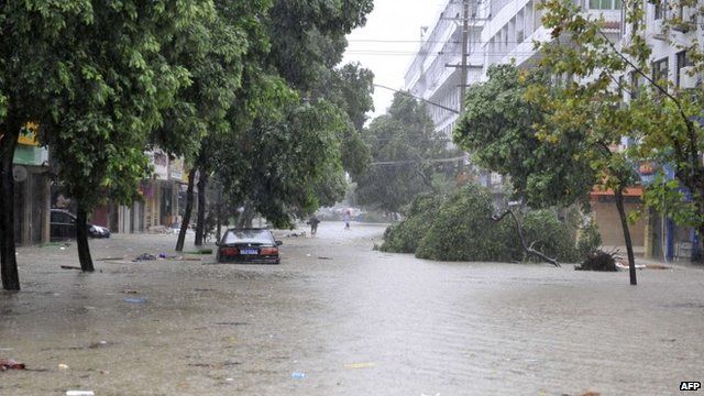 Car submerged on a flooded street