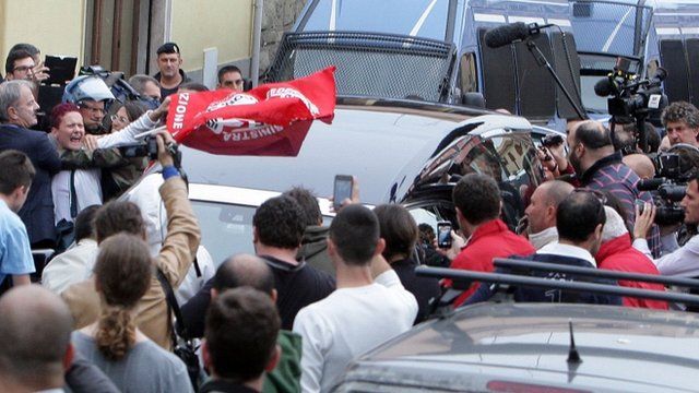 Protesters surround the hearse carrying the coffin of Nazi war criminal Erich Priebke