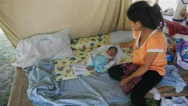 Eileen Rose Carabana looking at baby James