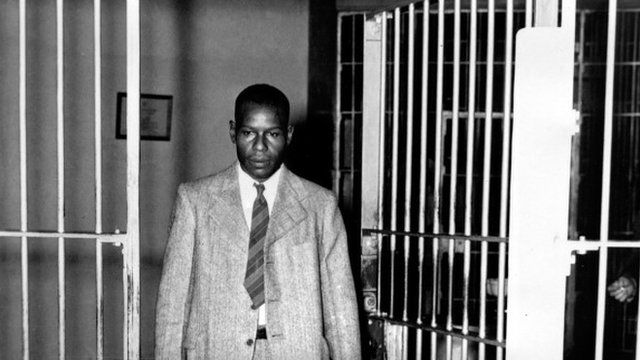 Clarence Norris walks through the main cell gate at Kilby Prison in Montgomery, Ala., after receiving his parole after serving nine years of a life sentence, 1946