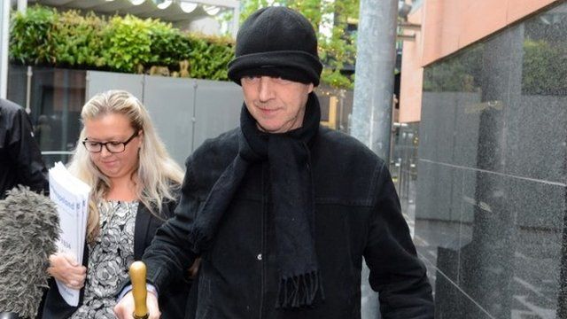 Ray Teret (centre), 72, Jimmy Savile's former flatmate and chauffeur, leaves Manchester Magistrates Court
