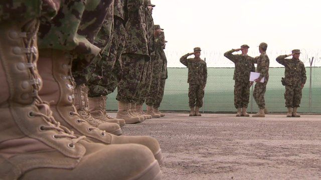 Close-up of army boots as soldiers are inspected